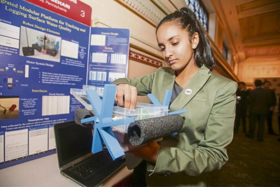 Meghna displays her aqua-bot creation in Washington.