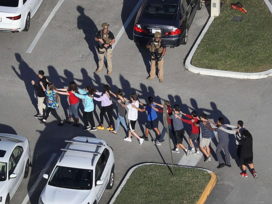 Students are escorted out of Marjory Stoneman High School

