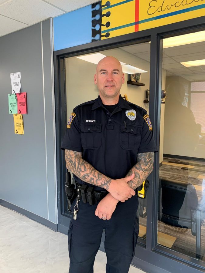 Officer Metzger and his tattoos