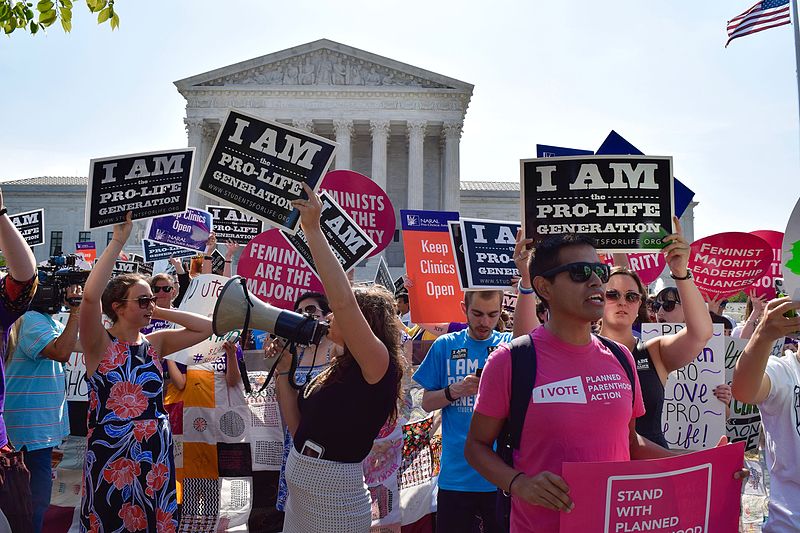 Pro-choice and pro-life protestors outside of the Supreme Court building