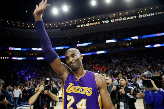 Los Angeles Lakers' Kobe Bryant waves to the crowd after an NBA basketball game against the Philadelphia 76ers, Tuesday, Dec. 1, 2015, in Philadelphia. Philadelphia won 103-91. (AP Photo/Matt Slocum)