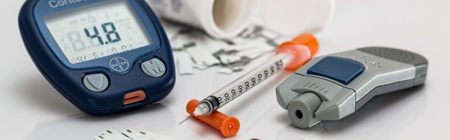 Stock image of standard Insulin needles and a glucose monitor