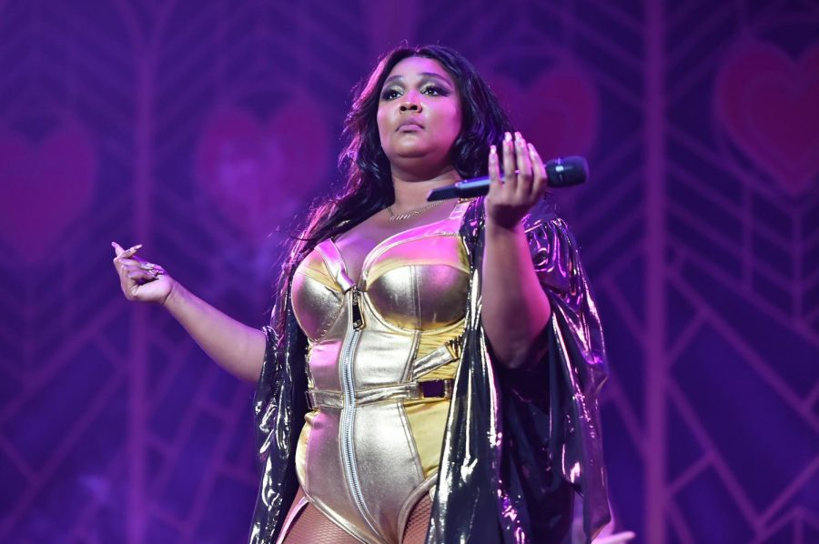 Lizzo displaying her I Dont Care attitude on stage at a performance.