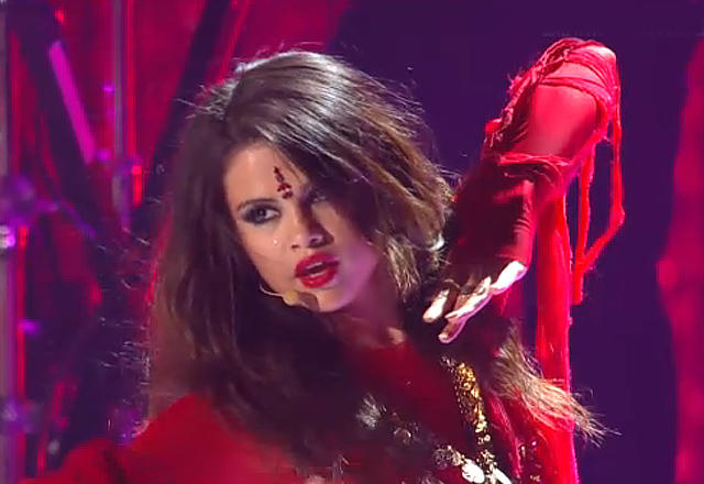 Selena Gomez wearing a bindi and Indian garments in a performance at the MTV Movie Awards.