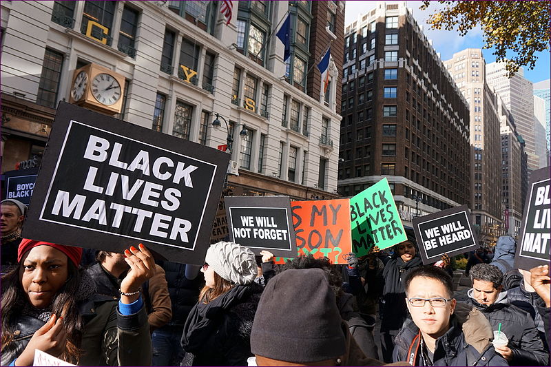 Protestors at a Black Lives Matter protest fighting for Black rights and the memory of victims.