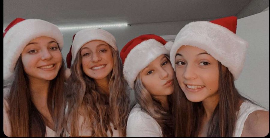 Addy Celender and her friends participating in Christmas activities.