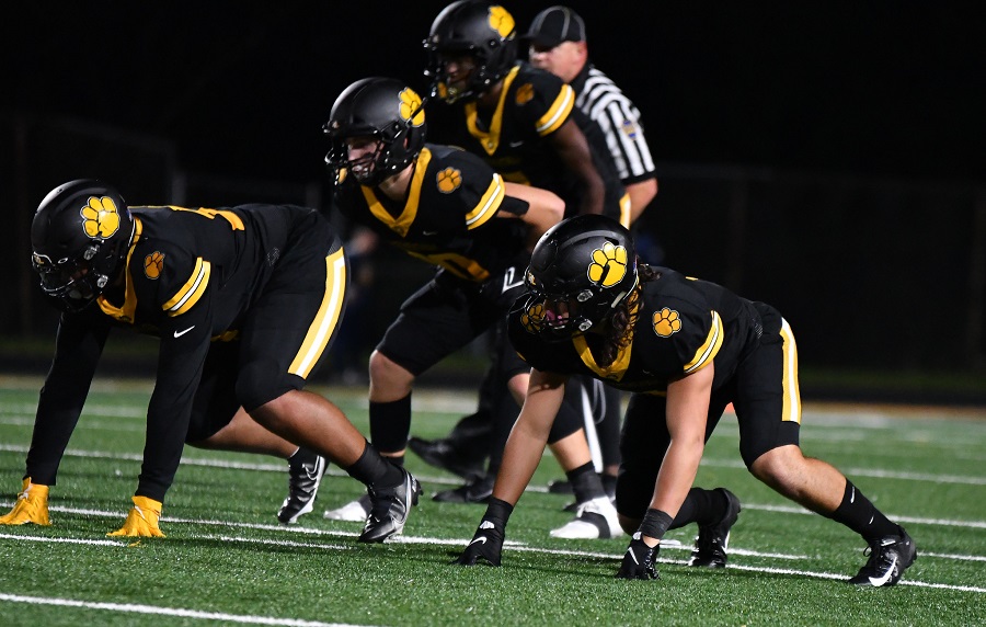 The Tigers' defense lines up against Central Catholic on Sept. 24.