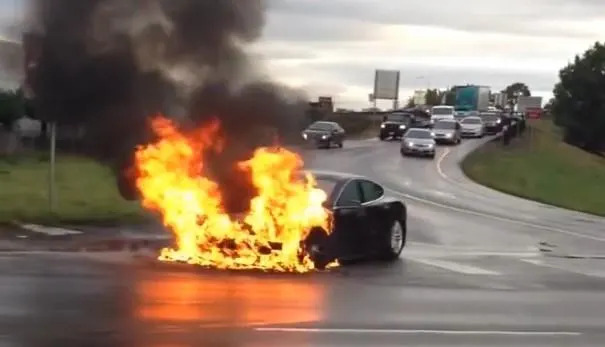 A Tesla Model S (seen here in 2013) burns after its battery compartment was pierced by a piece of metal.
