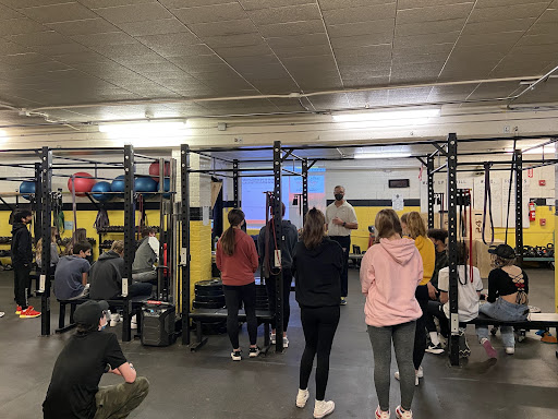 Mr. Schmidt teaching a new lesson to his fourth period P.E. class.