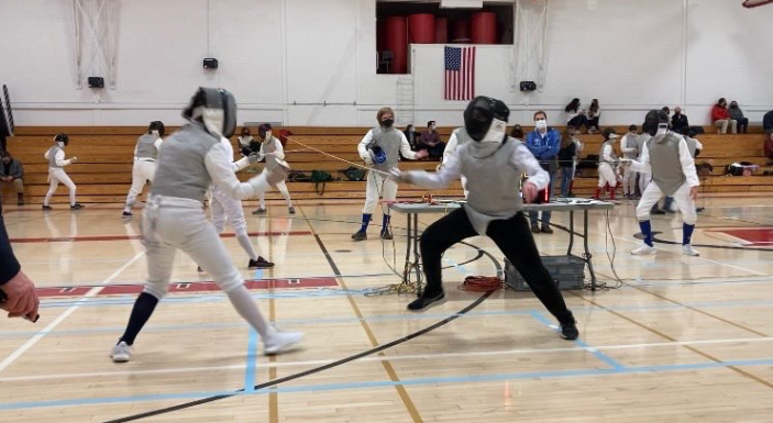 A+member+of+the+NA+Fencing+team+competes+in+a+meet+in+2022.