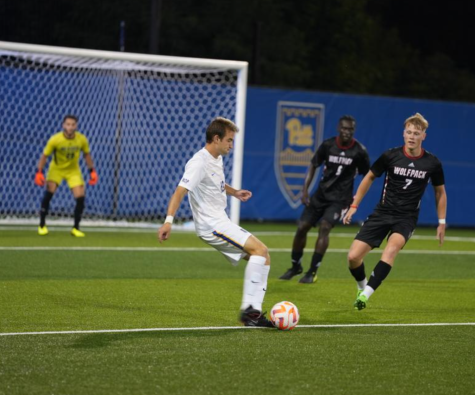 Josh Luchini controls the ball in a game against NC State on September 16, 2022.