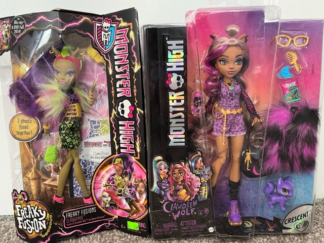 A Monster High Clawdeen Wolf doll from 2014 on the left, and one from this year on the right. 