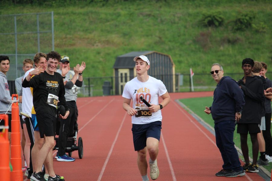 Fans cheer as Rotunno finishes the final lap of the 100 mile relay.