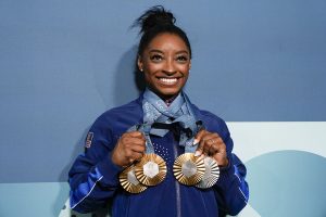 Biles wins 4 medals in Paris and furthermore proves her title as the GOAT. 