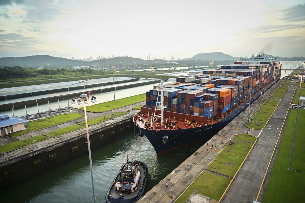 A large container ship passing through the Panama Canal as Trump advises US military officials to develop plans for the region.